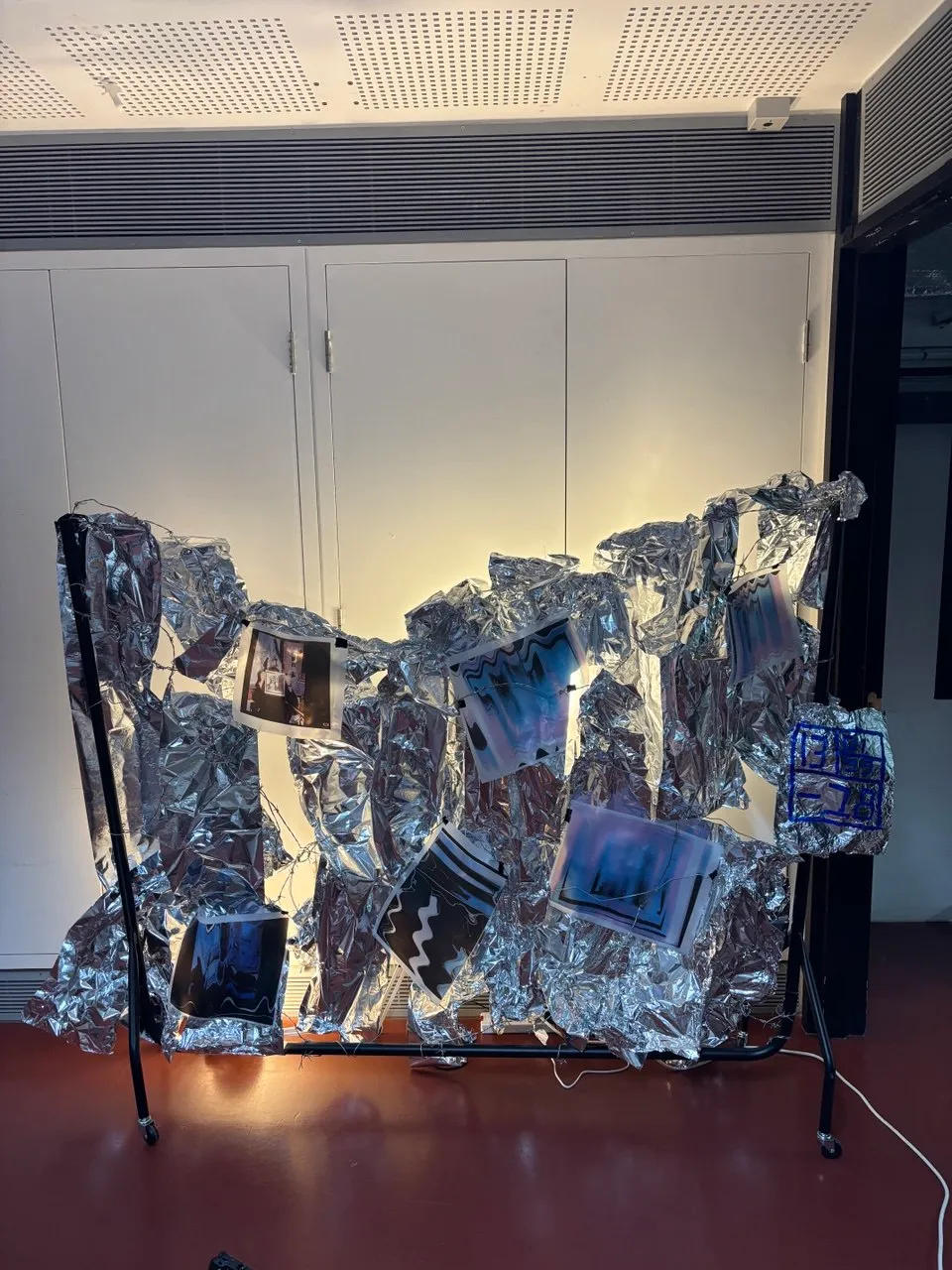 Wind, Metal, barbwire, foil, archival inkjet prints, light bulbs, 240 x 20 x 160cm, 2025 by Paul Tymoshenko